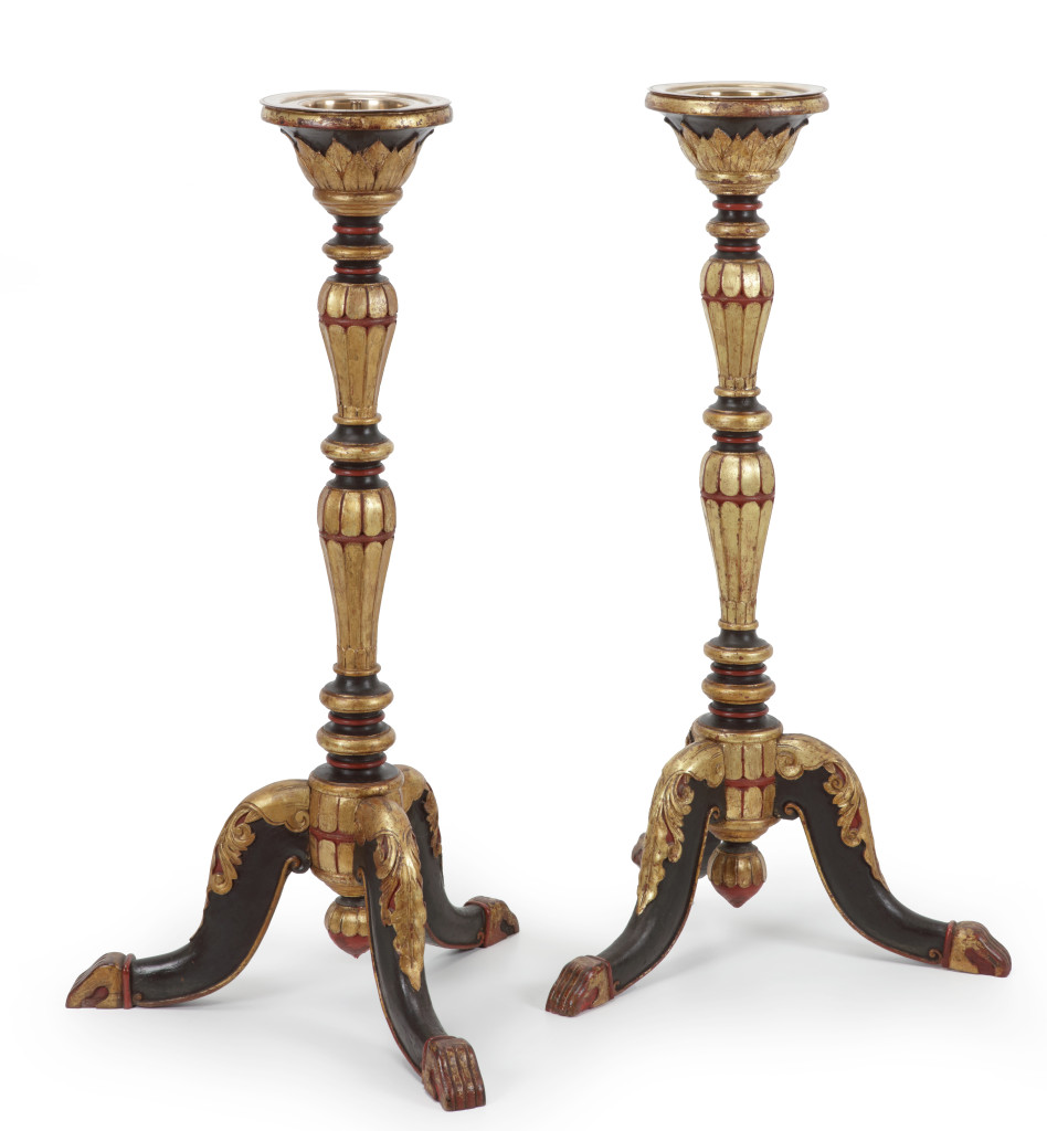 A pair of Indonesian lacquered and gilt teak torchères or candle stands