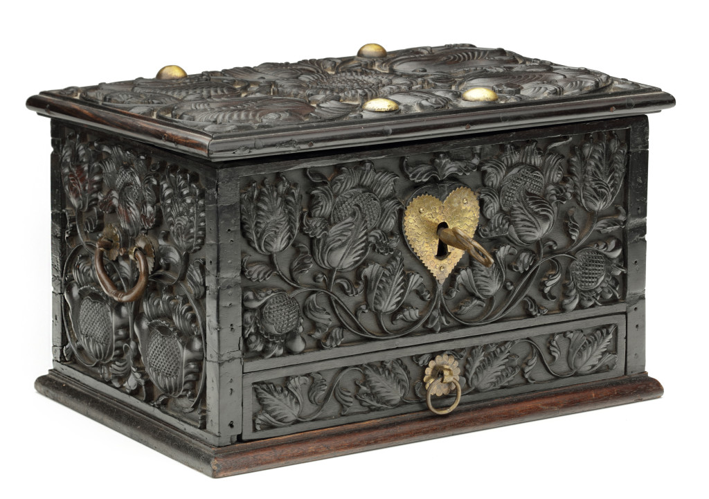 An Indonesian carved ebony box with drawer and brass mounts