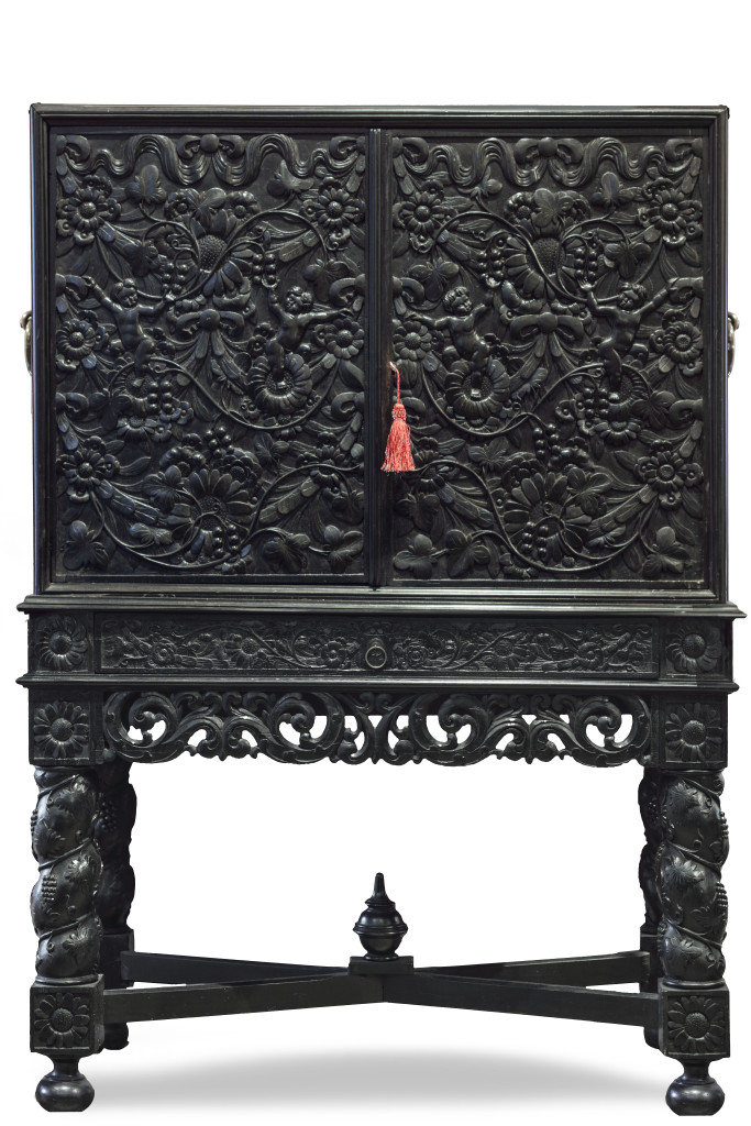 An important Indonesian ebony and ebonized cabinet on stand
