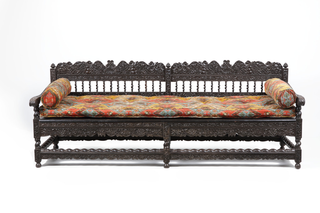 An exceptionally large Indonesian kaliatur and teak wood two-part bench