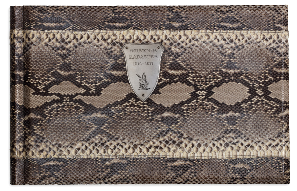 An important commemorating Indonesian carved Sawo wood box containing a luxurious photo album