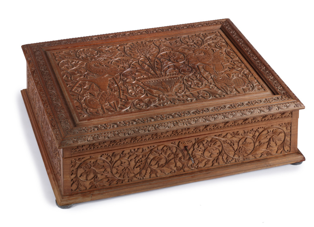 An important commemorating Indonesian carved Sawo wood box containing a luxurious photo album