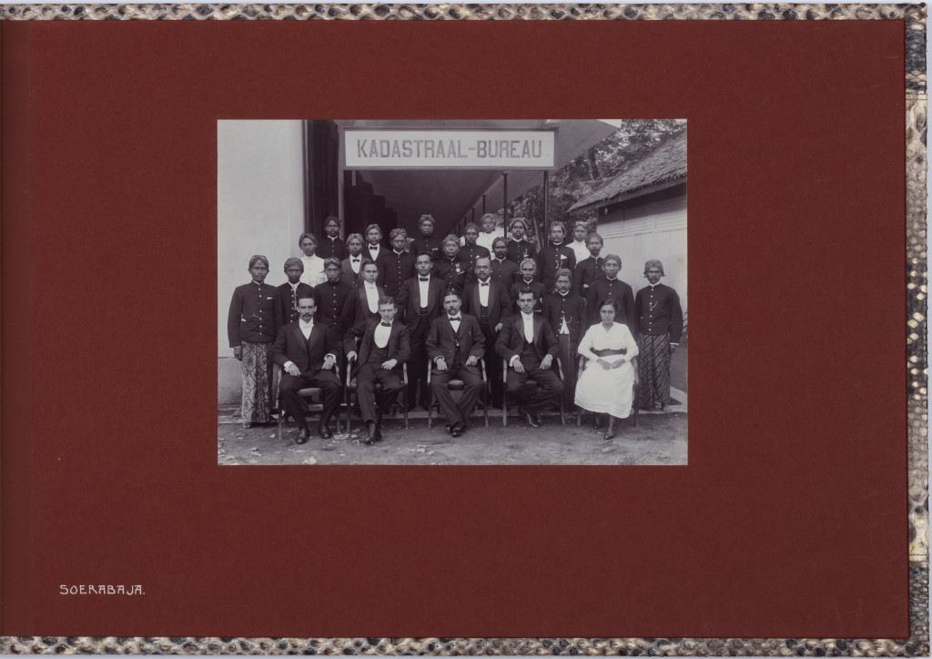 An important commemorating Indonesian carved Sawo wood box containing a luxurious photo album
