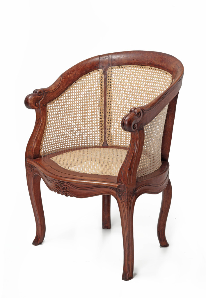 An Indonesian teak wood round-back chair