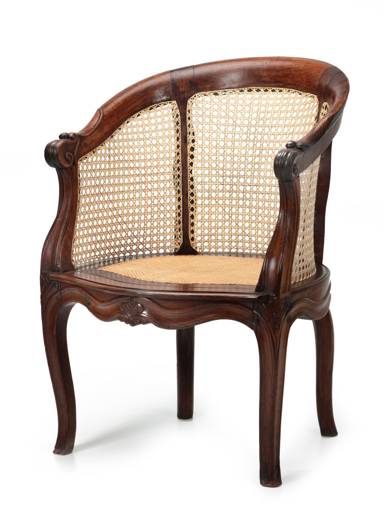 An Indonesian teak wood round-back chair