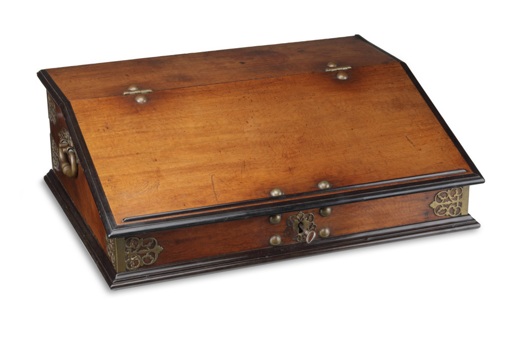 A large Indonesian Amboyna and Ebony portable writing desk with brass mounts