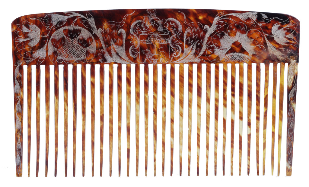A pair of Jamaican colonial engraved tortoiseshell combs