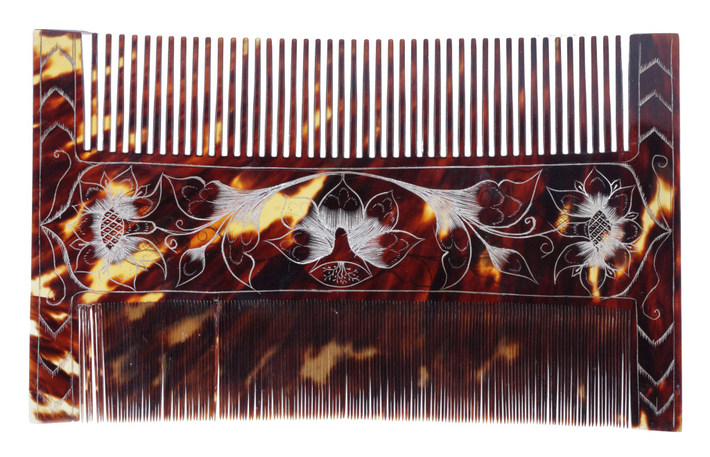 A pair of Jamaican colonial engraved tortoiseshell combs