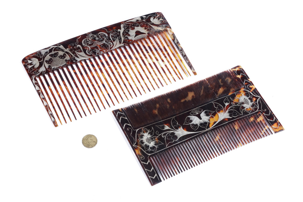 A pair of Jamaican colonial engraved tortoiseshell combs