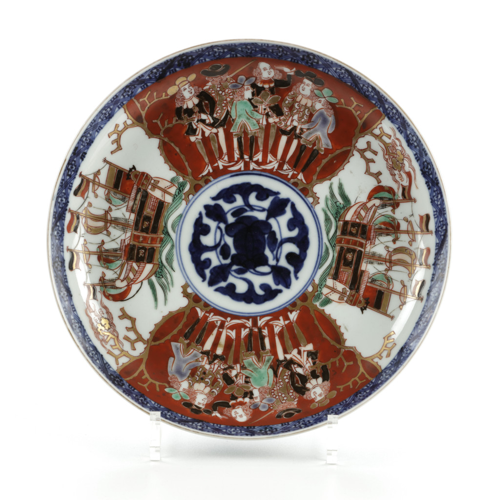 A Japanese Arita porcelain Imari-style vowl and cover with Dutchmen