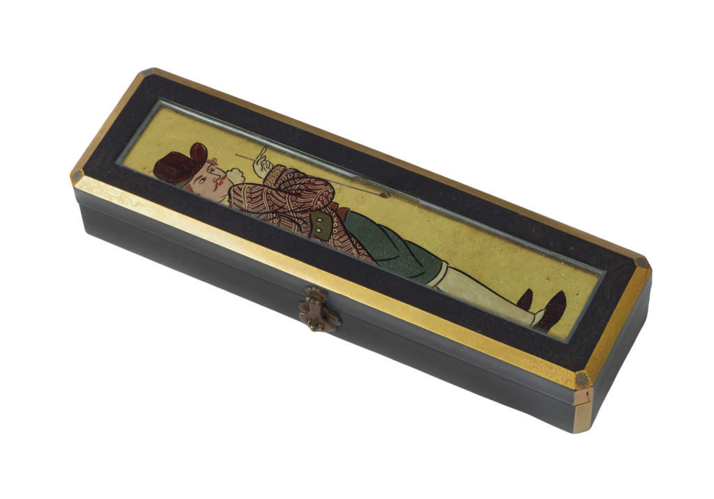 A Japanese lacquer box with a reverse-glass painting of a Dutchman