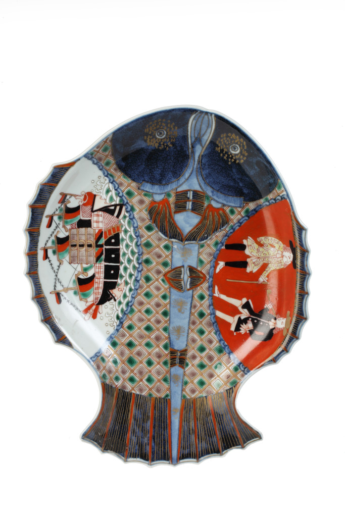 A Japanese Arita porcelain fish-formed dish with Dutchmen