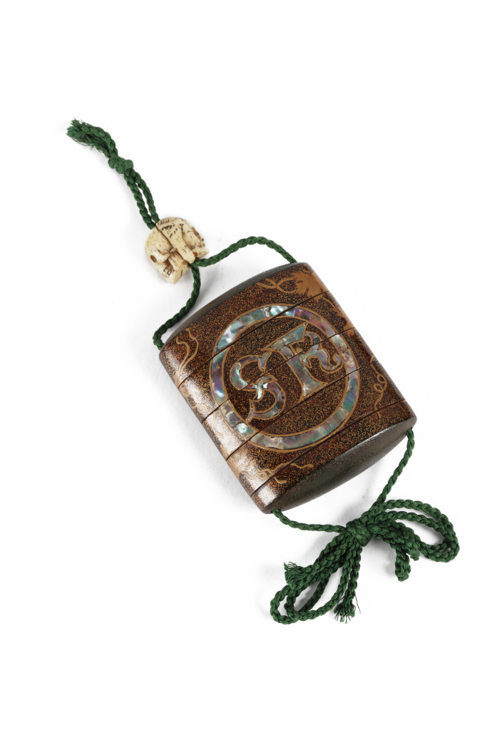 An important and early Japanese Namban four-case inro with the initials of Saint-Francis and Ojime in the form of Jesus and a skull