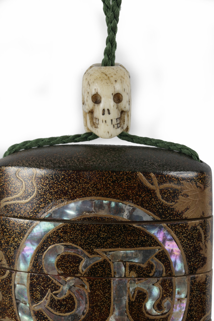 An important and early Japanese Namban four-case inro with the initials of Saint-Francis and Ojime in the form of Jesus and a skull