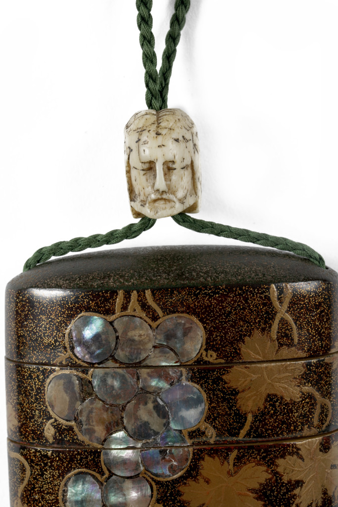 An important and early Japanese Namban four-case inro with the initials of Saint-Francis and Ojime in the form of Jesus and a skull