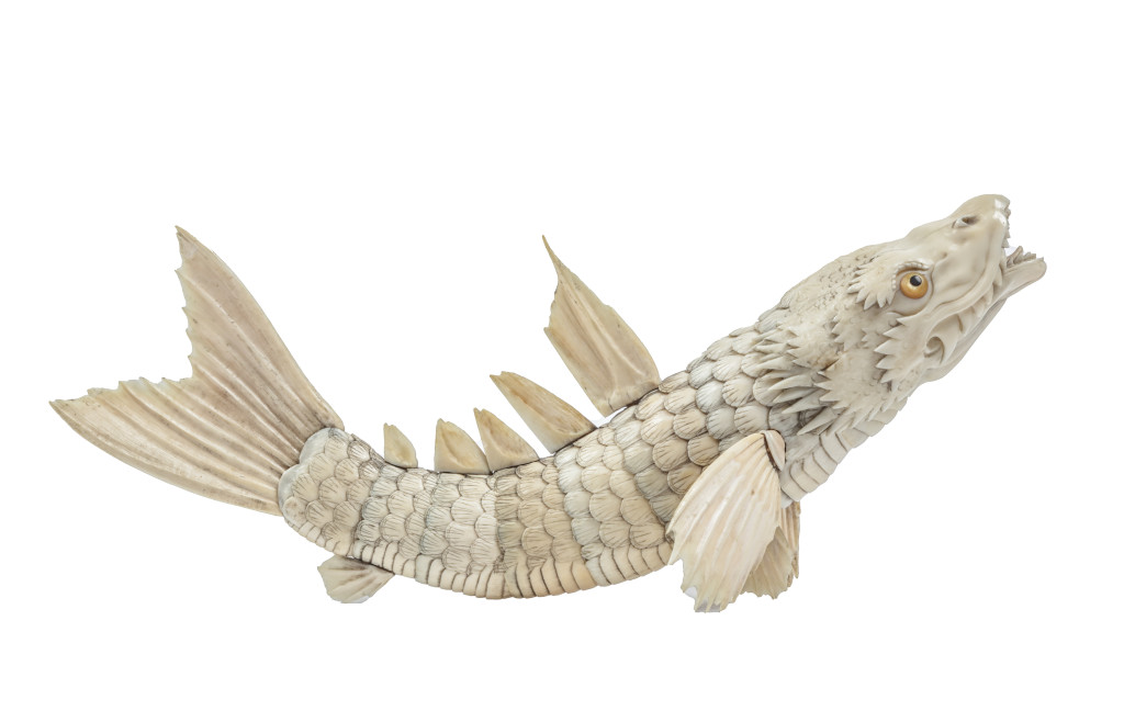 A Japanese ivory and bone fully articulating okimono of a dragonfish