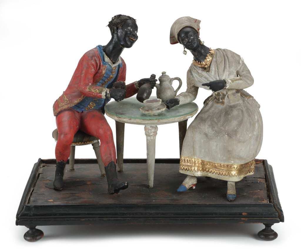 A rare French colonial sculpture of a couple from the French 'West Indies', drinking Rum and Cocoa