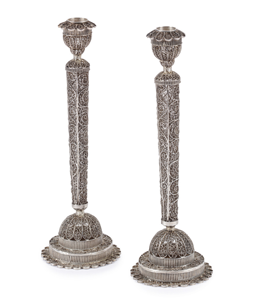 A rare pair of silver filigree candle sticks