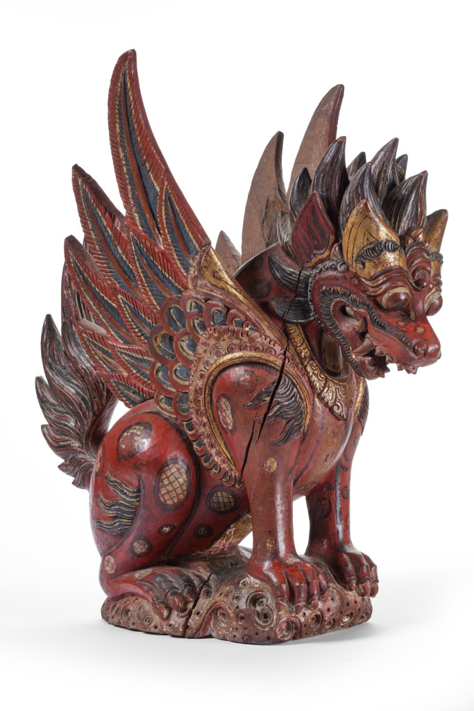A Balinese polychrome and gilt wood sculpture of a winged lion, Singa Bersayap