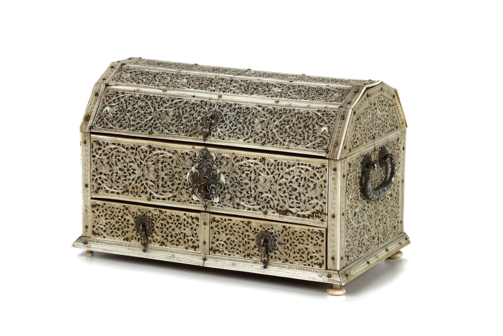 A Sri Lankan openwork-carved ivory and mica covered wood box with trapezoid-shaped lid and silver mounts