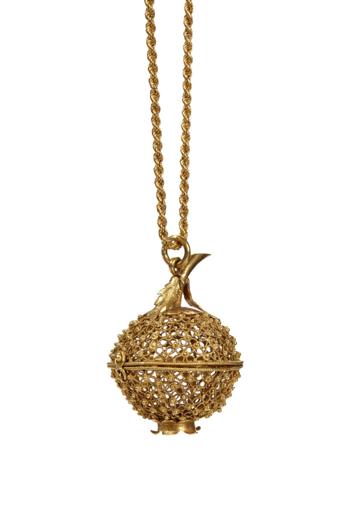 An Indonesian hinged spherical gold filigree container for a 'Pedro de Porco' (pig's stomach stone)