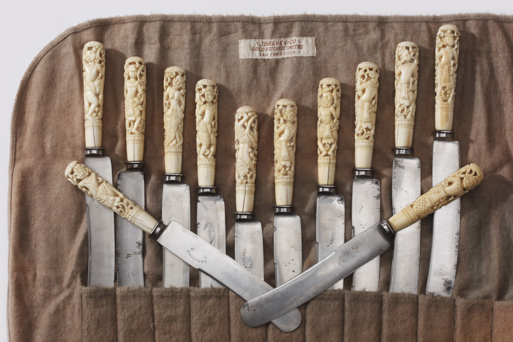 A rare set of twelve Burmese knives with intricately carved ivory handles