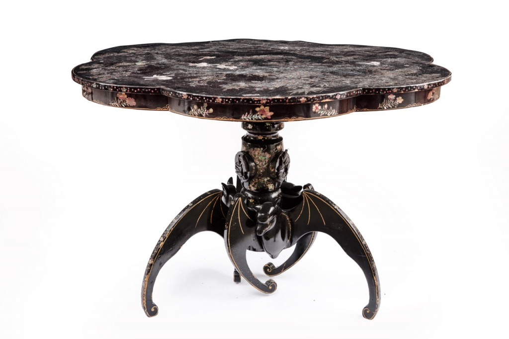 A Japanese export lacquer tripod table with feet shaped as bats