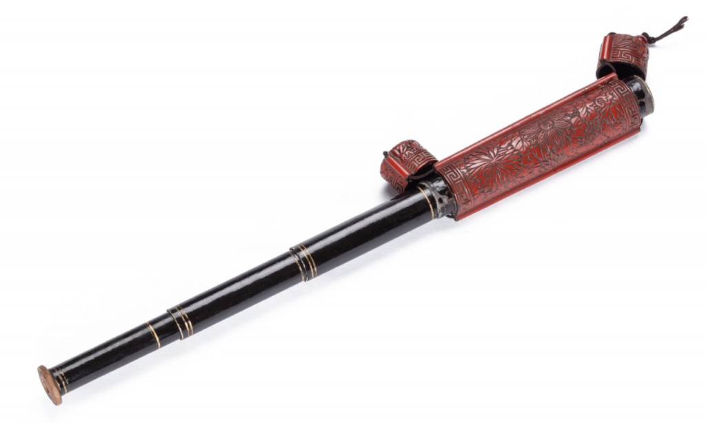 An exceptional Japanese carved red choshitsu lacquer telescope