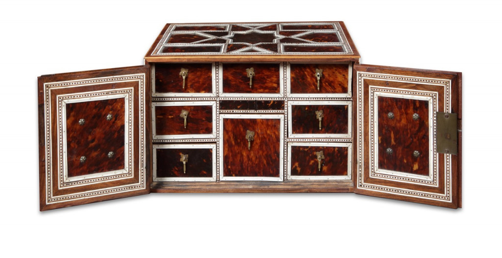 An Indian colonial tortoiseshell and bone veneered teak portable two-door cabinet
