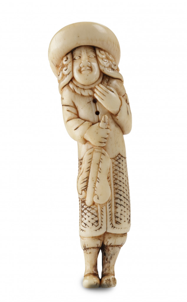 A marine ivory netsuke of a Dutchman holding a Chinese fan