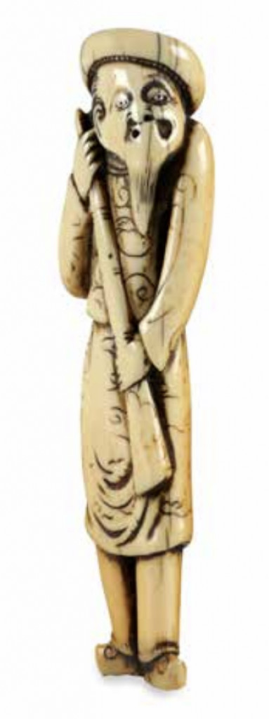 An ivory netsuke of a tall Dutchman