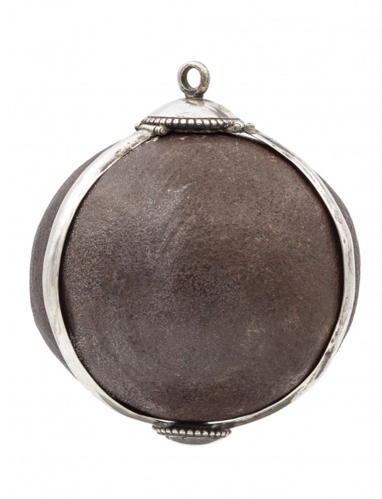 A Bezoar stone with a silver mounted frame
