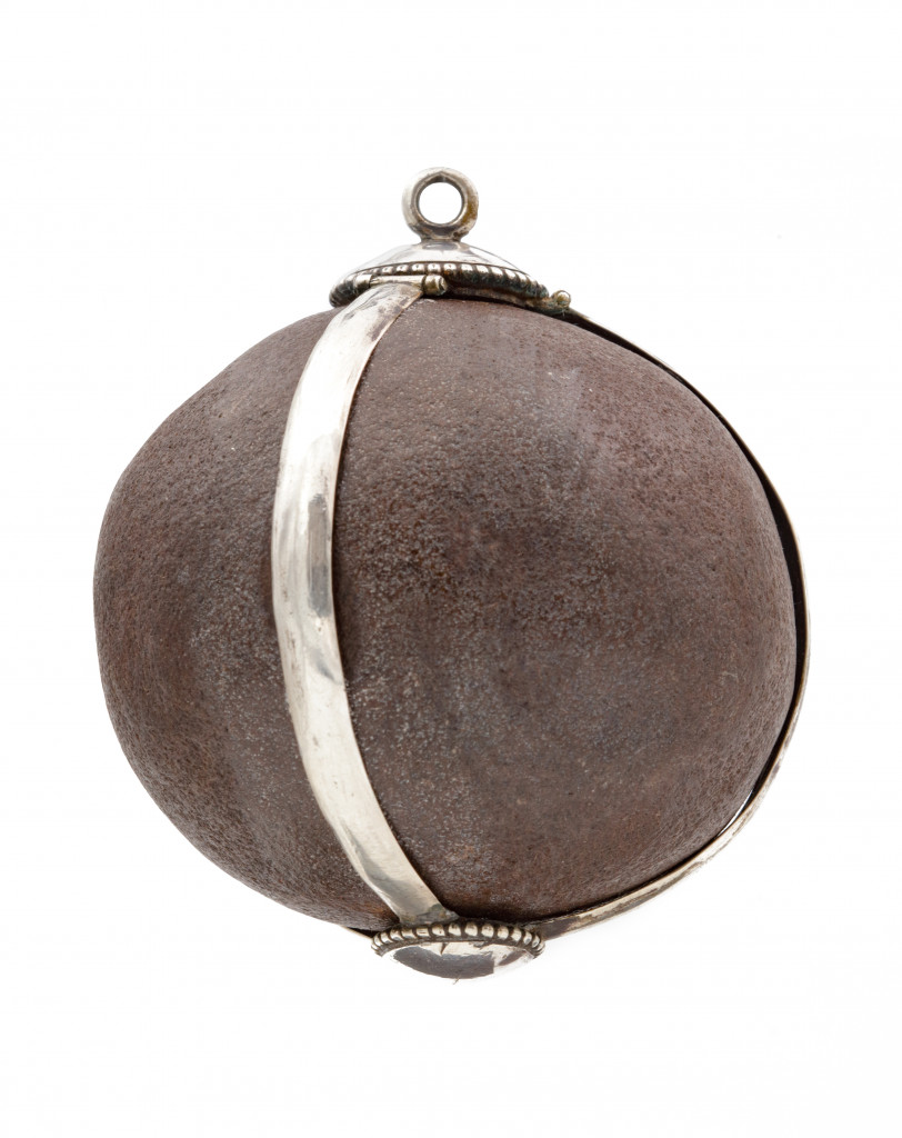 A Bezoar stone with a silver mounted frame