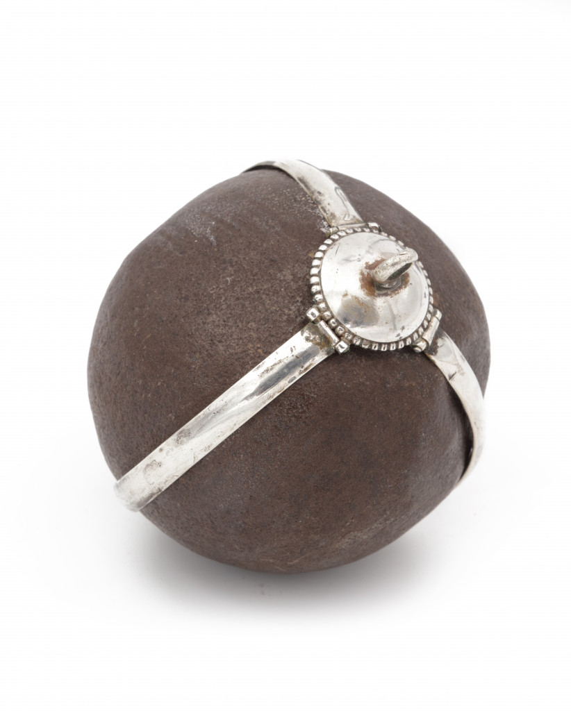 A Bezoar stone with a silver mounted frame