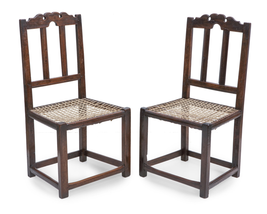 A pair of stinkwood and leather-strip Cape Dutch 'riempie' chairs