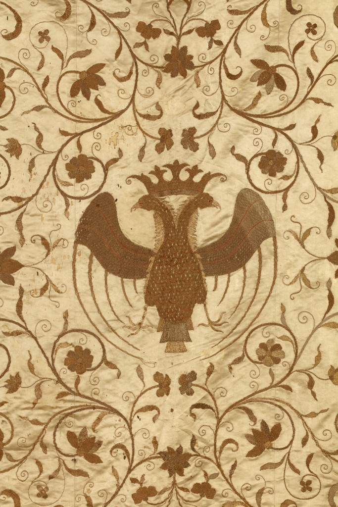 A large Chinese export white gold embroidered silk bed-cover or wall-hanging