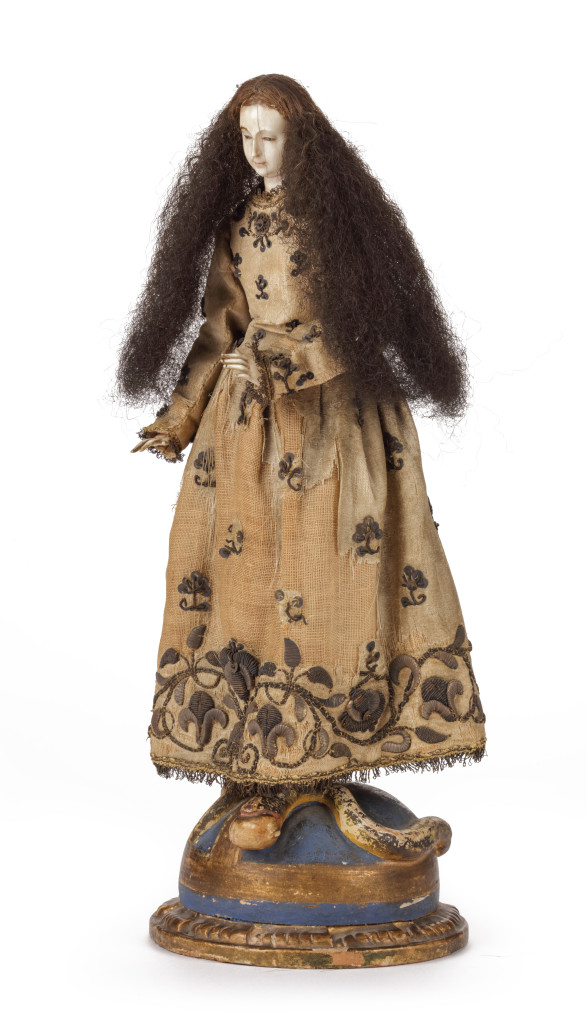 A Spanish-colonial Filipino wood, ivory, human hair and textile sculpture of the Virgin trampling the snake
