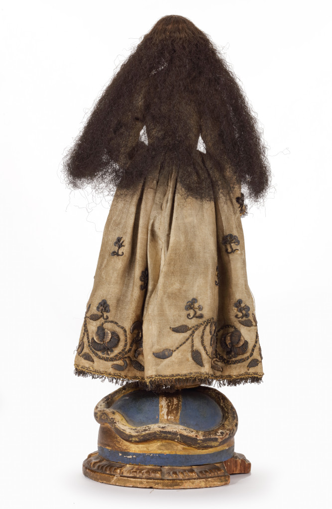 A Spanish-colonial Filipino wood, ivory, human hair and textile sculpture of the Virgin trampling the snake