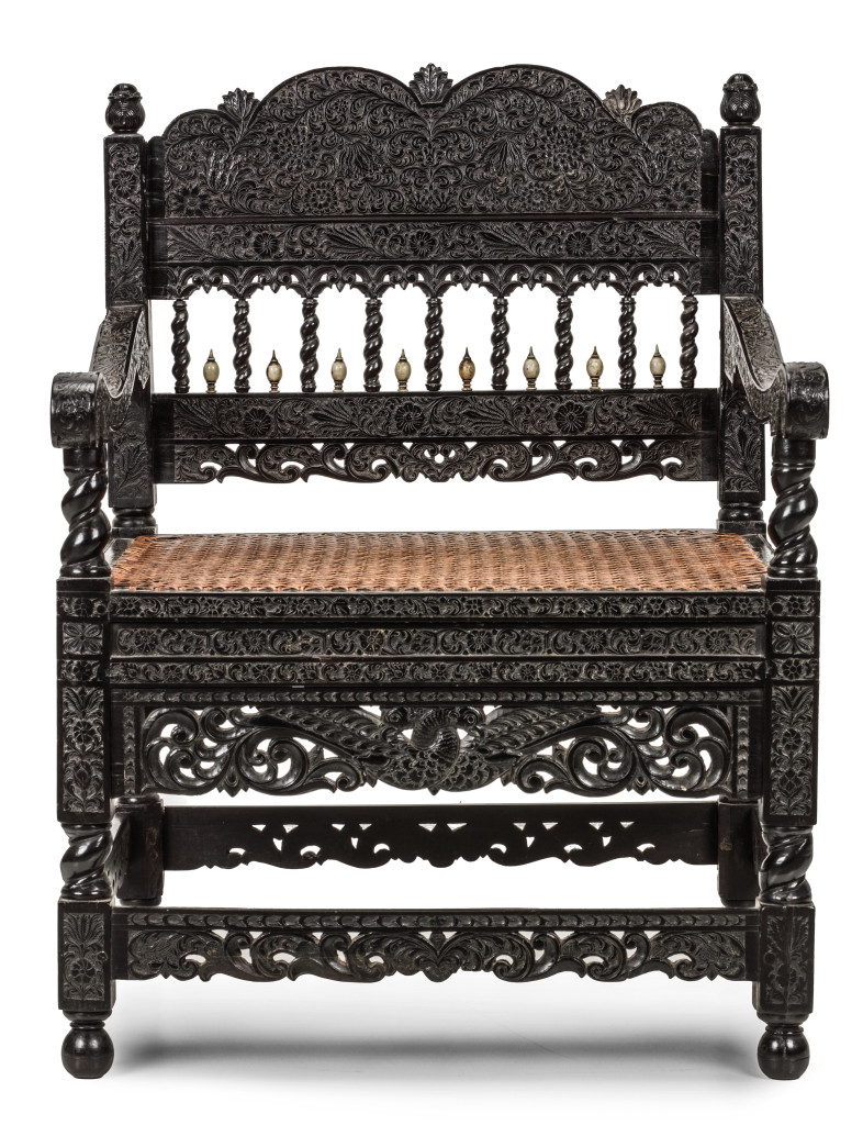 A Dutch-colonial ebony armchair with low-relief carving