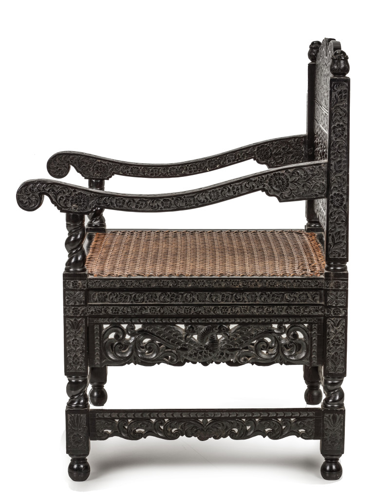 A Dutch-colonial ebony armchair with low-relief carving
