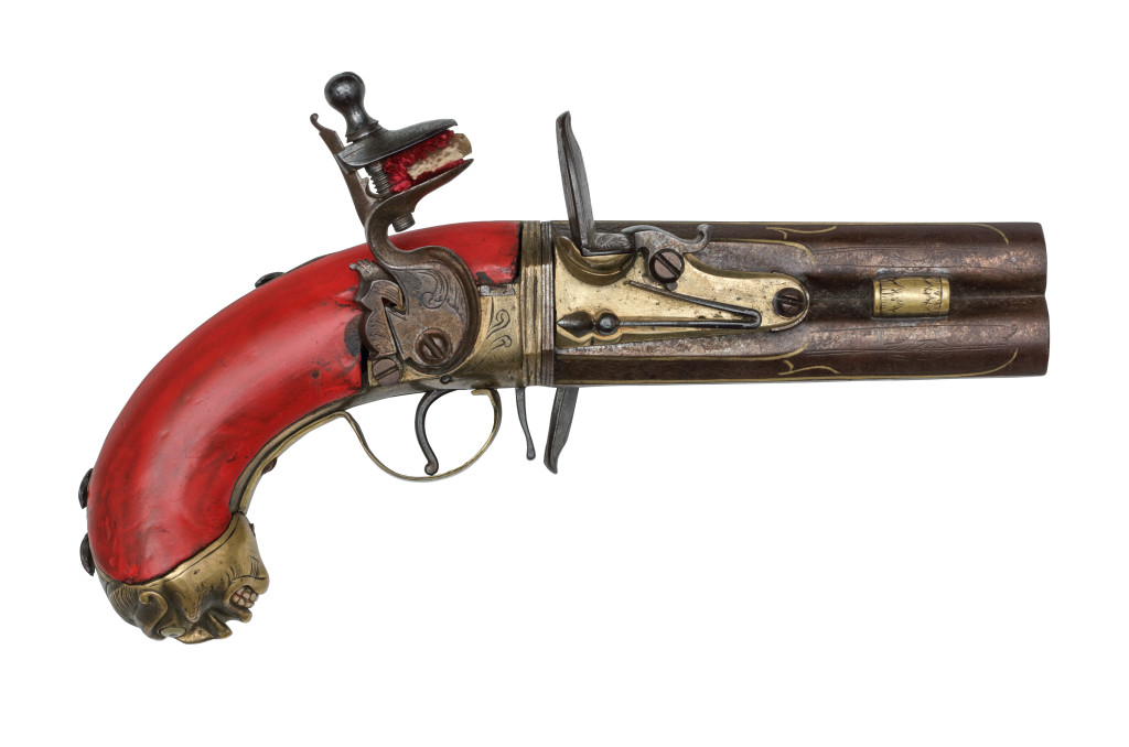 A lacquered wood, part-gilt steel colonial revolving flintlock pistol