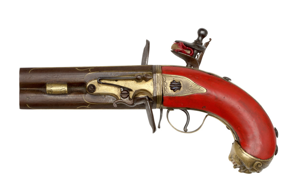 A lacquered wood, part-gilt steel colonial revolving flintlock pistol