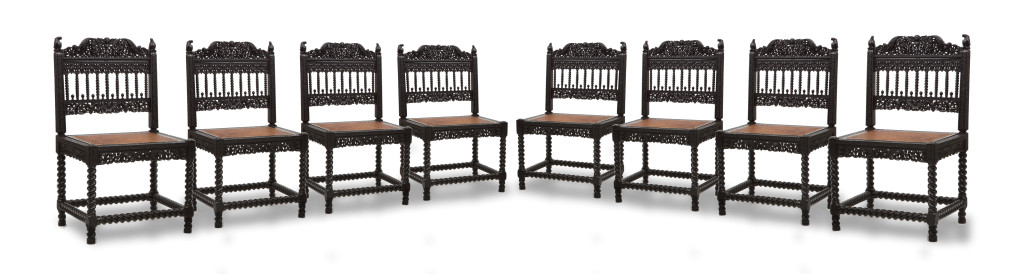 A large set of sixteen fine colonial ebony side chairs and an armchair
