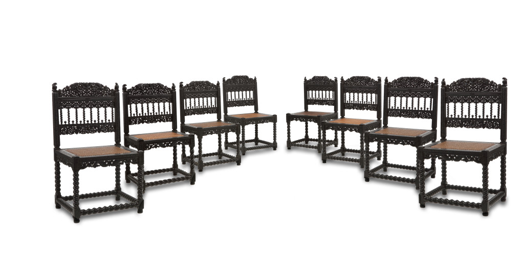 A large set of sixteen fine colonial ebony side chairs and an armchair