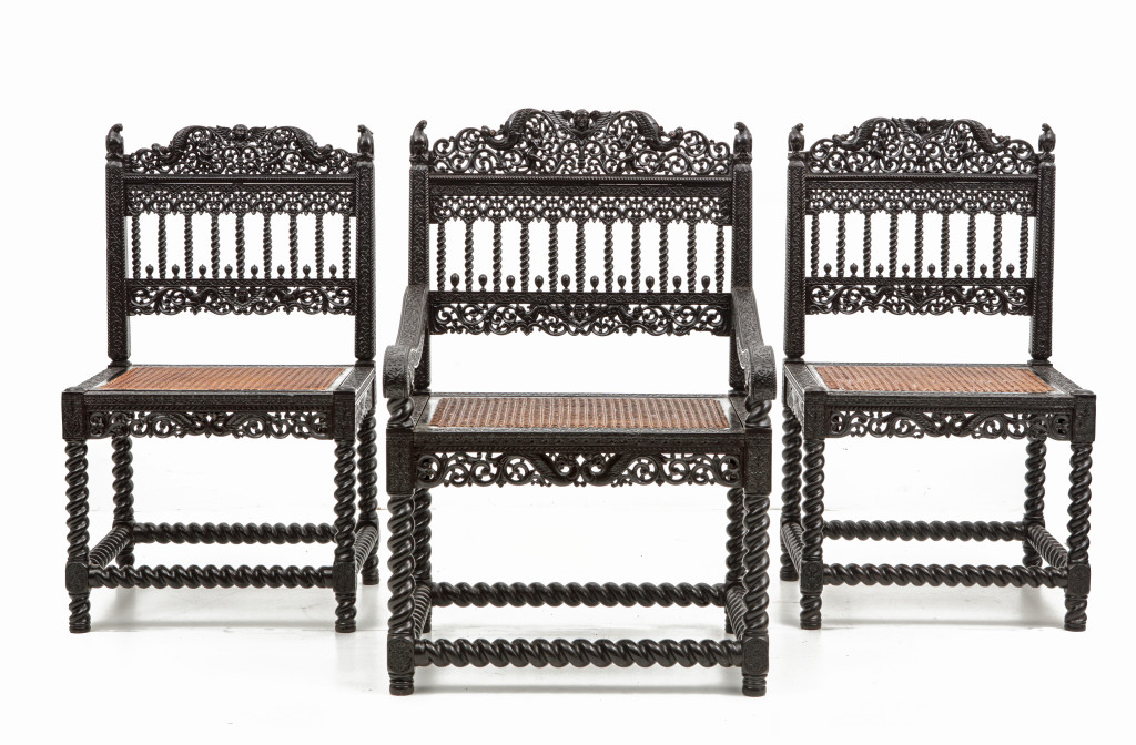 A large set of sixteen fine colonial ebony side chairs and an armchair