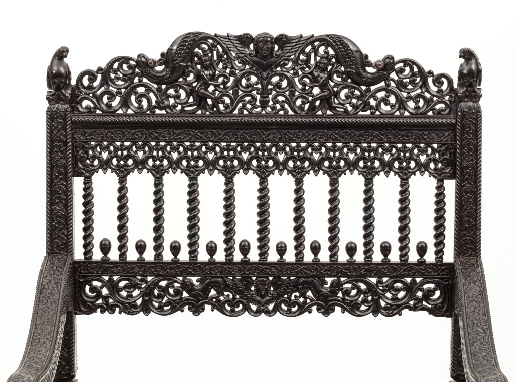 A large set of sixteen fine colonial ebony side chairs and an armchair