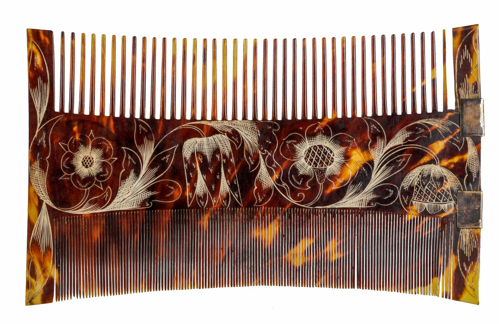 A Jamaican colonial engraved tortoiseshell comb-case and two combs