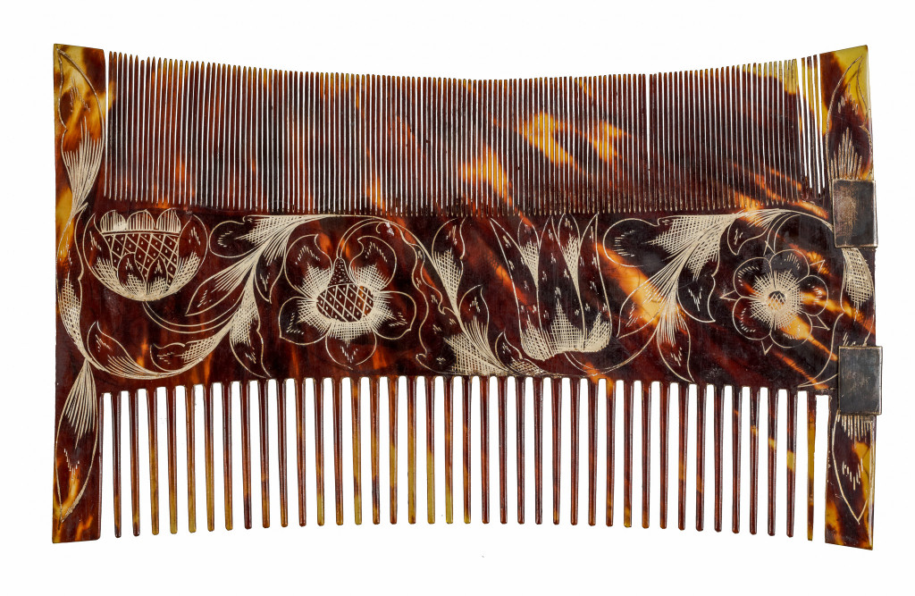 A Jamaican colonial engraved tortoiseshell comb-case and two combs