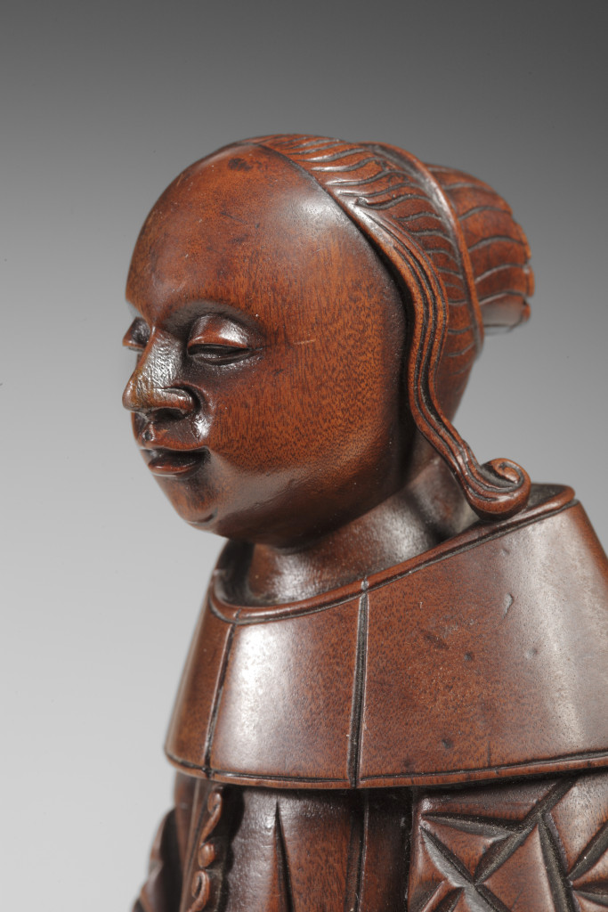 A highly unusual Chinese sandalwood figure of a Dutch lady