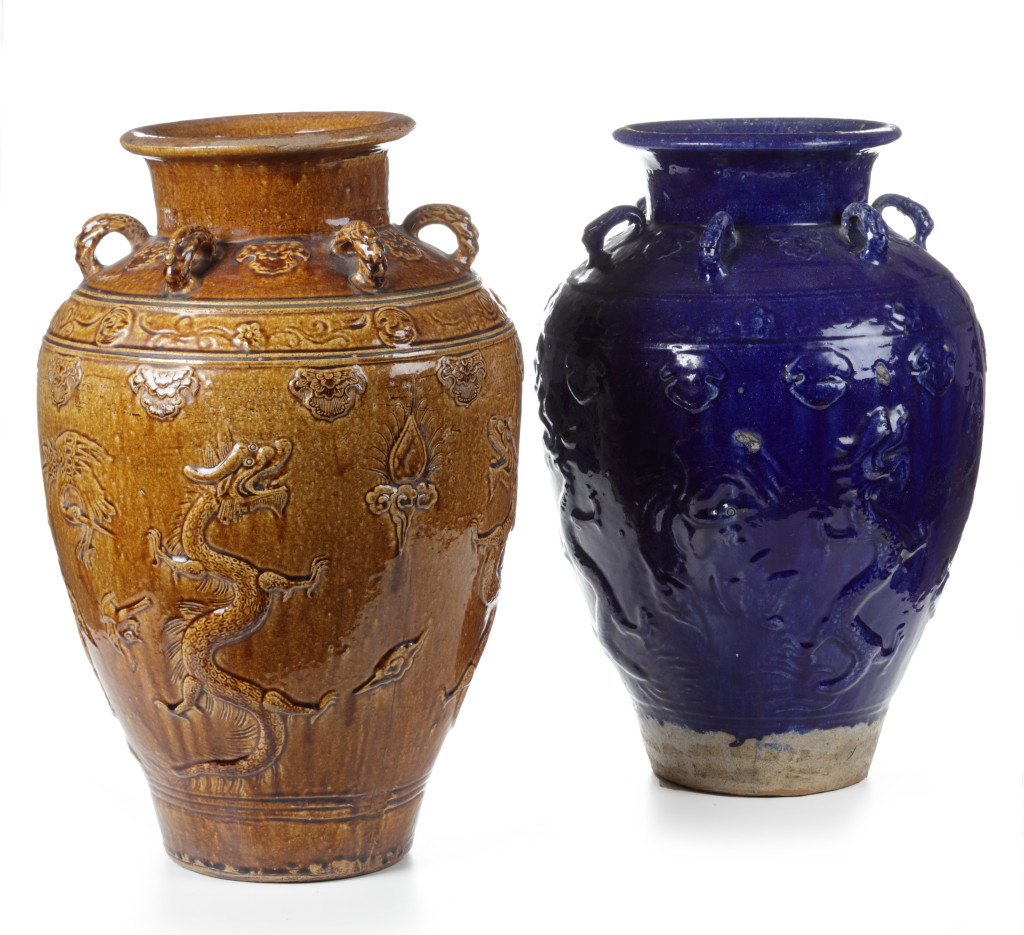 One brown glazed and one in blue glaze, both decorated with dragons.